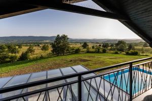 a view from the balcony of a house with a swimming pool at Villa Trn in Cetingrad
