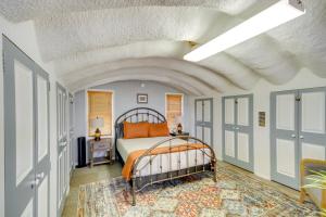 a bedroom with a bed and a white ceiling at Charming Bay St Louis Home Deck, on Canal! in Shoreline Park