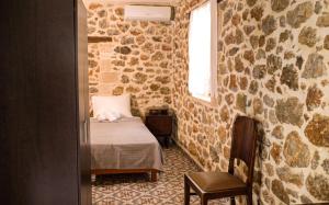 A bed or beds in a room at Mitato Eagle's Nest Peristeres