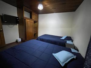 Postel nebo postele na pokoji v ubytování Casa Esther
