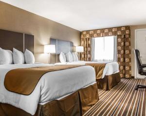 Cama o camas de una habitación en Quality Inn & Suites
