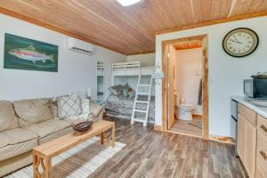 a living room with a couch and a table at Norfork Studio by White River Ideal for Fishing! in Norfork
