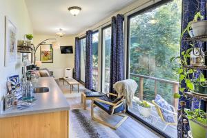 a kitchen with a large window and a living room at Northern Star - Studio in Fairbanks