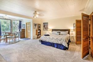 a bedroom with a bed and a dining room at Northern Star - Studio in Fairbanks