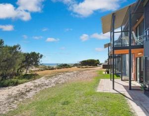 a house with a view of a dirt road at Beachfront Escape in Port Adelaide