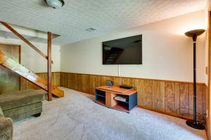 a living room with a couch and a table at Howard Cabin Rental about 3 Mi to Apple Valley Lake! in Mount Vernon