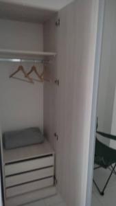 an empty closet with a shelf and a drawer at Departamento en Villa Elisa. in Villa Elisa