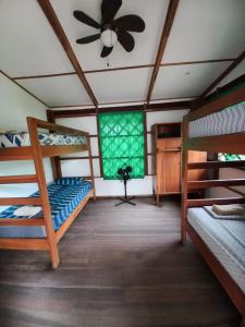 Katil atau katil-katil dalam bilik di Pagalù Hostel