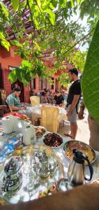 a table with plates of food on top at Chez Imnir in Ijjoukak