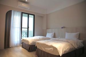 Sunny Sky Homestay客房内的一张或多张床位