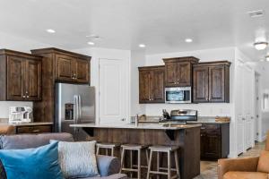 a kitchen with wooden cabinets and a counter top at Narrow's Gateway townhouse in Washington +27 photos