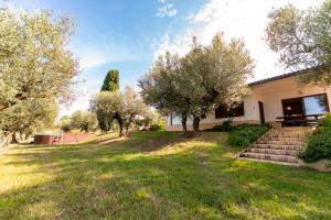 a house with a yard with trees and stairs at Villa Ninetta in Bucchianico