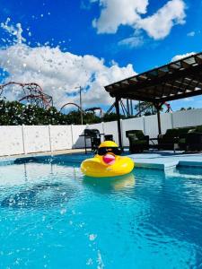 a yellow rubber boat in a swimming pool at Busch Gardens Deluxe Edition w/heatedpool in Tampa