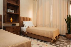 Postel nebo postele na pokoji v ubytování Auberge RIAD DLIM Tamraght