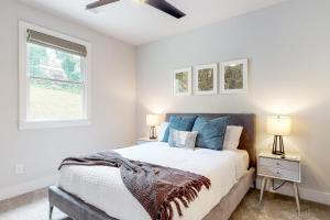 a bedroom with a bed and two lamps at In the Heart of the City in Marietta