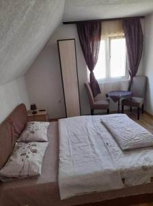 Postel nebo postele na pokoji v ubytování Golubović Apartments
