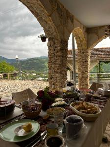 a table with food on top of a table at Amrots Deghceni - Boutique Castle Stay in Dilijan