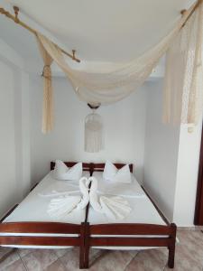 מיטה או מיטות בחדר ב-Casa Ellamy
