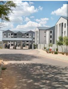 an empty parking lot in front of a building at Ladybug unit 3 (2) in Midrand