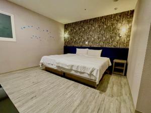 Postel nebo postele na pokoji v ubytování Walker Hotel - Zhengyi