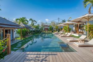 an image of a swimming pool at a resort at EHOA BALI Nyanyi Boutique Hotel - In front of entrance to NUANU in Tanah Lot