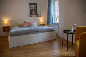 Postel nebo postele na pokoji v ubytování Suite Barrique Zell