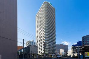 a tall building in the middle of a city at Meteor Shower in Sapporo