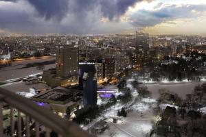 a view of a city at night with snow at Meteor Shower in Sapporo