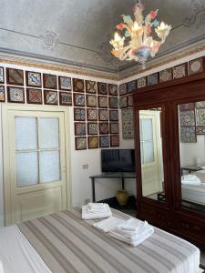 a bedroom with a bed with towels on it at Stanze al Genio B&B in Palermo