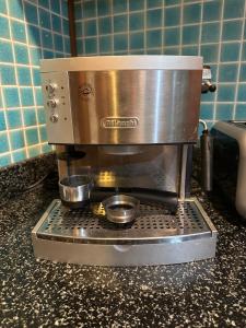 a coffee maker sitting on top of a counter at 2-Bedroom Khanom Beach Ocean Front Condo in Khanom