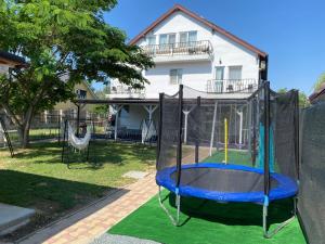 a playground in front of a house at Vile Mamaia Nord in Mamaia Sat/Năvodari