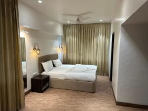Postel nebo postele na pokoji v ubytování Hotel Imperial Executive