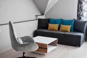 Posezení v ubytování Jarzębinowy Resort & SPA