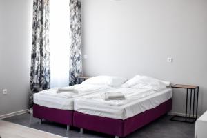 Postel nebo postele na pokoji v ubytování Jarzębinowy Resort & SPA