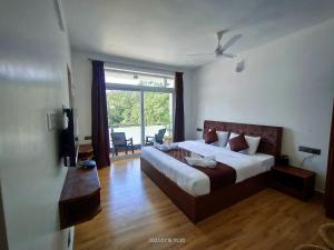 Voodi või voodid majutusasutuse Hotel NT Grand Yercaud toas