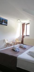 Postel nebo postele na pokoji v ubytování M7 Villa Bed& Bistro