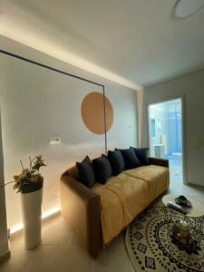 a living room with a couch in a room at cozy minimal apartment in Piraeus