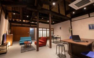 an office with a desk and chairs and a laptop at Oto Iro Riva HOUSE - Vacation STAY 18694v in Kure