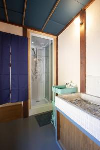 a bathroom with a shower and a glass door at Oto Iro Riva HOUSE - Vacation STAY 18694v in Kure