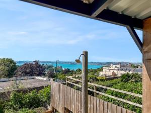 a view of the ocean from the porch of a house at The Lookout in Torquay