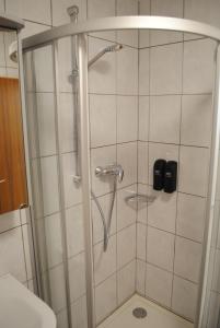 a shower with a glass door in a bathroom at FeWo-Hochblauen in Badenweiler