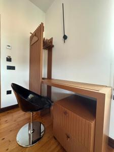 a desk and a chair in a room at Hotel El Rosal de Cudillero in Cudillero