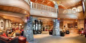 a large lobby with a large room with a large ceiling at CGH Résidences & Spas Orée Des Cimes in Peisey-Nancroix
