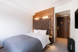 a hotel room with a bed and a television at The knot Sapporo - Vacation STAY 96374v in Sapporo
