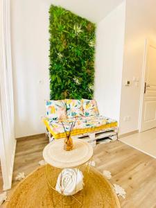 a living room with a couch and a table at LAKAZ CREOLE - Caen Centre in Caen