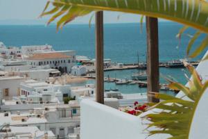 a view of a harbor from a hotel balcony at Legends in Town, by Mykonos High in Mikonos