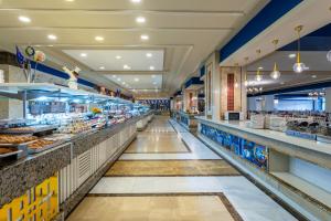 an aisle of a grocery store with food at Orange County Belek in Belek