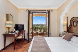 Postel nebo postele na pokoji v ubytování La Vecchia Fonte Boutique Hotel