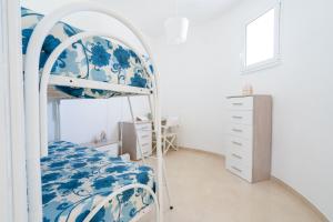 Postel nebo postele na pokoji v ubytování Dimora le Dune a 100 MT dal mare