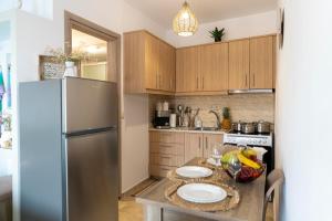 Kuchyň nebo kuchyňský kout v ubytování Georgia Apartment